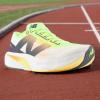 imageNew Balance Womens FuelCell Rebel V4 Running ShoeWhiteBleached Lime GloHot Mango